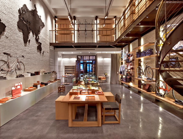 With brick walls, a cement floor and sleek oak shelving, the store has an industrial chic vibe that showcases the merchandise well. 