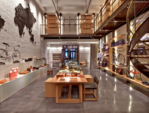 With brick walls, a cement floor and sleek oak shelving, the store has an industrial chic vibe that showcases the merchandise well.
